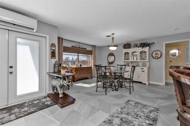 dining area featuring a wall unit AC