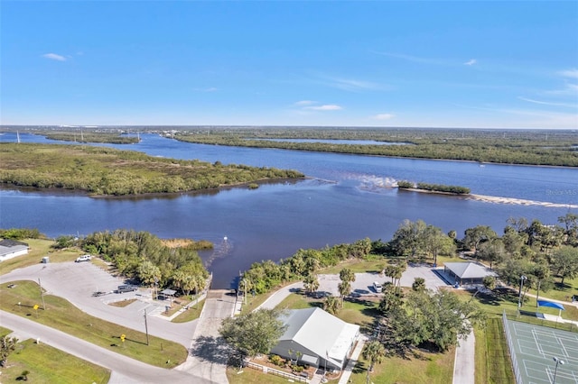 birds eye view of property with a water view