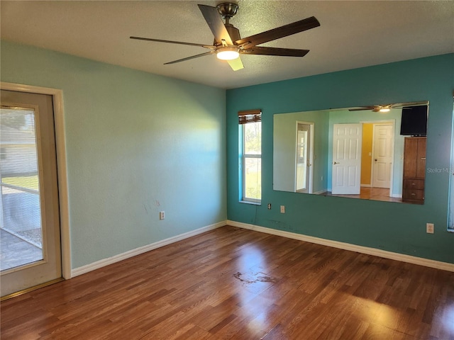 unfurnished room featuring hardwood / wood-style floors and ceiling fan