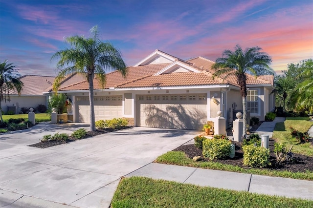 mediterranean / spanish-style house featuring a garage