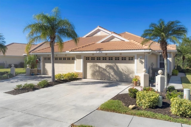 mediterranean / spanish home featuring a garage