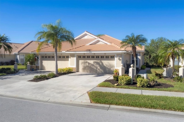 mediterranean / spanish-style house with a garage