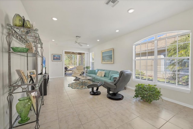 tiled living room with ceiling fan