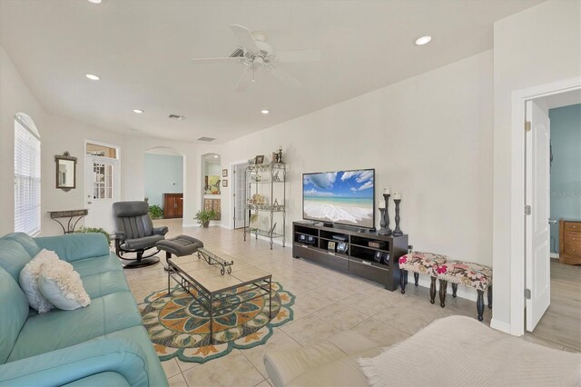 tiled living room with ceiling fan