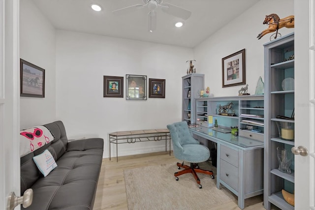 office space with ceiling fan and light hardwood / wood-style flooring