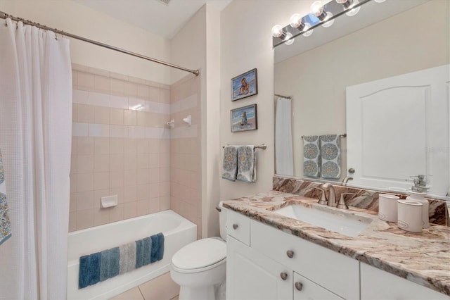 full bathroom featuring tile patterned flooring, vanity, toilet, and shower / tub combo