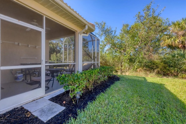 view of yard with a sunroom