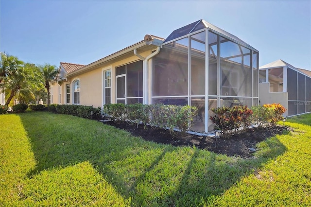 view of side of home featuring a yard