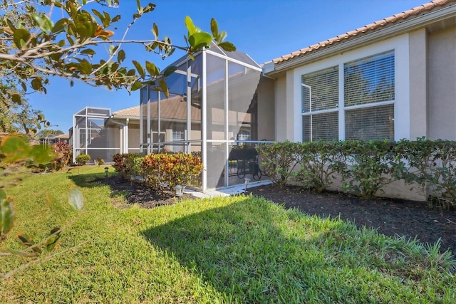 view of yard featuring a lanai