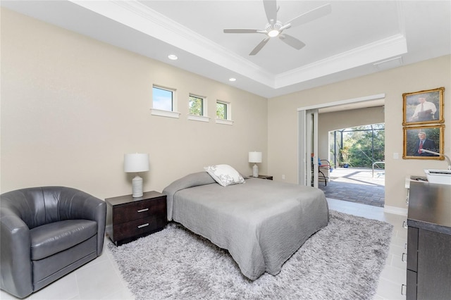 tiled bedroom with access to exterior, ceiling fan, a raised ceiling, and ornamental molding