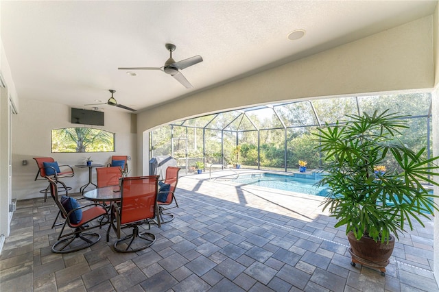 view of patio / terrace with a lanai and ceiling fan