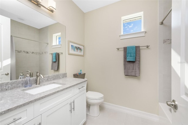 bathroom featuring tile patterned floors, vanity, and toilet