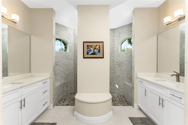 bathroom with tile patterned floors, plenty of natural light, and vanity