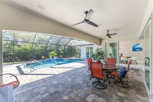 view of pool with a patio, ceiling fan, and a lanai