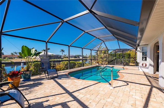 view of swimming pool with a lanai and a patio area