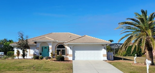 mediterranean / spanish home with a lanai, a front lawn, and a garage