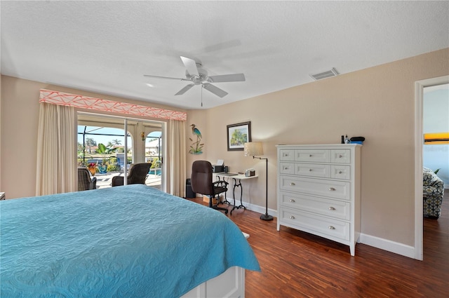 bedroom with a textured ceiling, ceiling fan, dark hardwood / wood-style floors, and access to outside