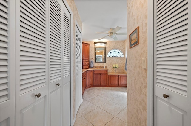 hallway featuring light tile patterned floors