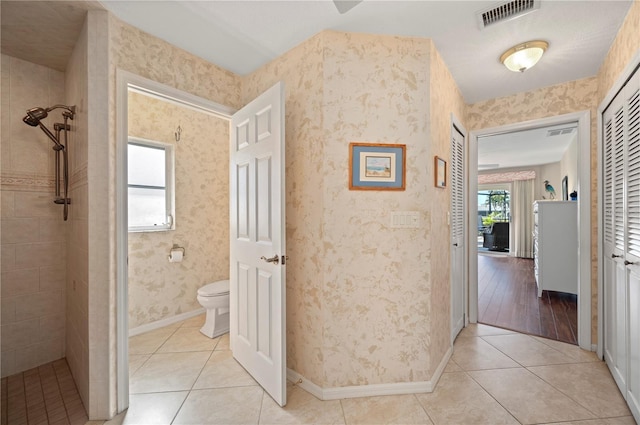 corridor with light tile patterned floors