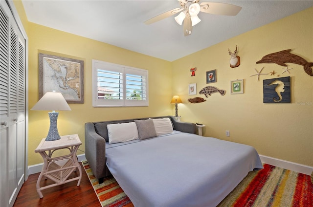 bedroom with ceiling fan, a closet, and hardwood / wood-style floors