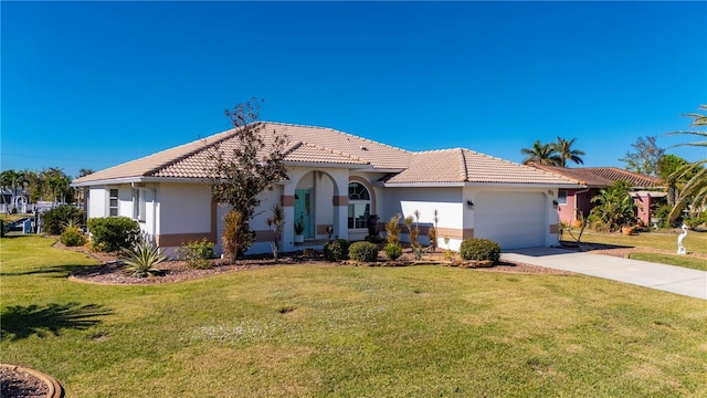 mediterranean / spanish-style home with a garage and a front yard