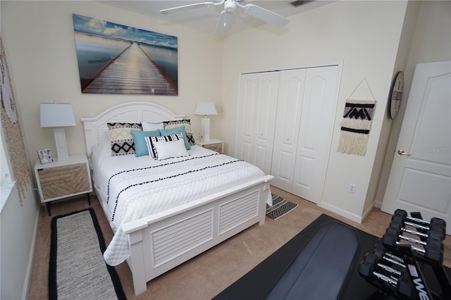 bedroom with carpet flooring, ceiling fan, and a closet