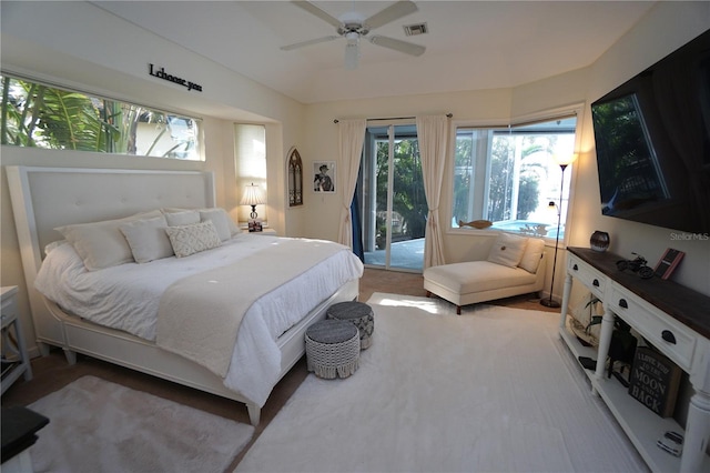 carpeted bedroom featuring ceiling fan and access to exterior