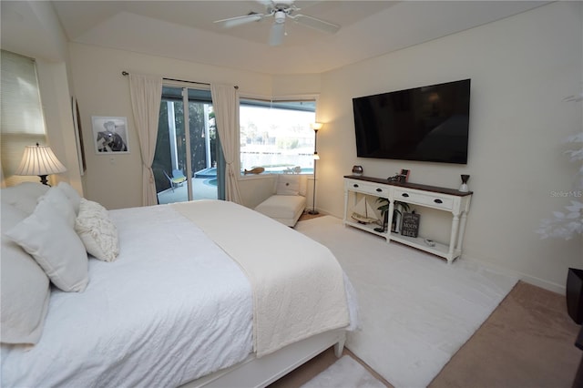 carpeted bedroom featuring access to exterior and ceiling fan