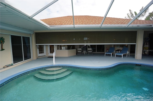 view of pool featuring a lanai and a patio area