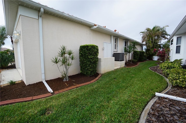 view of property exterior featuring a lawn