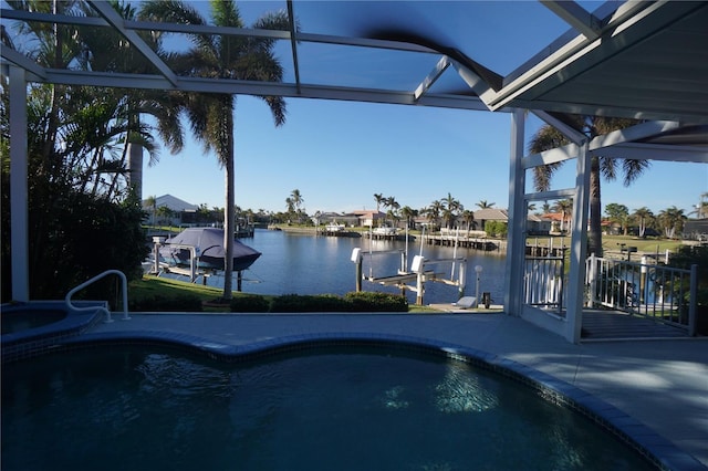 view of swimming pool with a water view and a dock