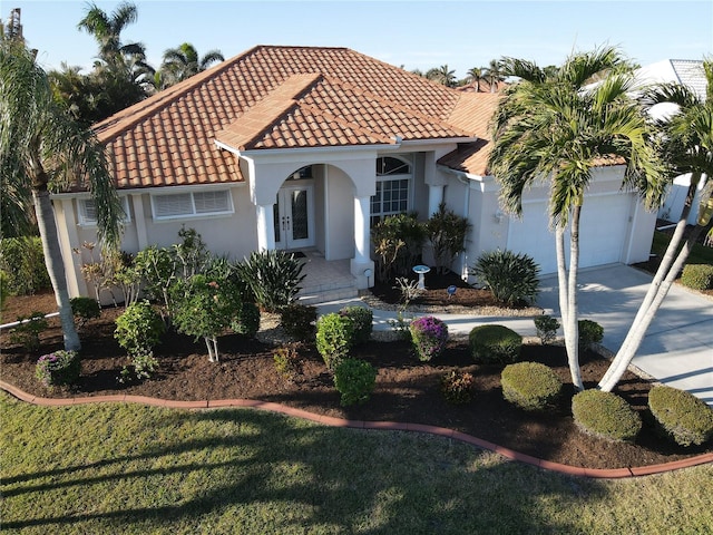 mediterranean / spanish-style house featuring a garage