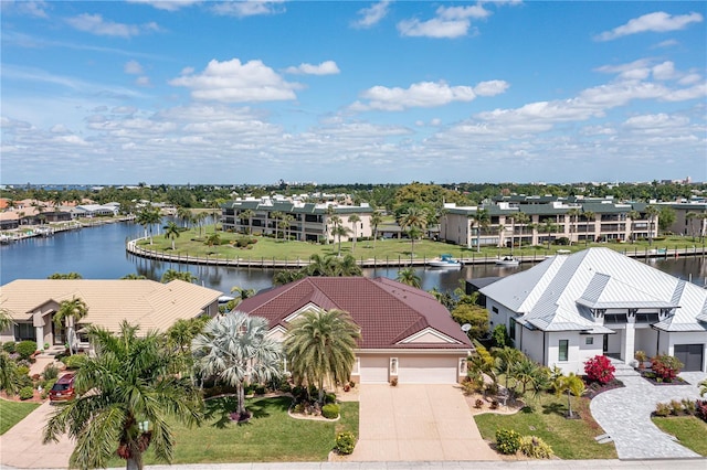 birds eye view of property with a water view