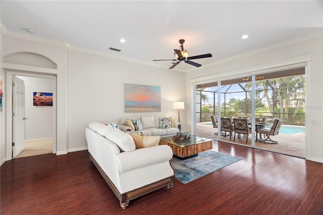 living room with ceiling fan, plenty of natural light, and dark wood-type flooring