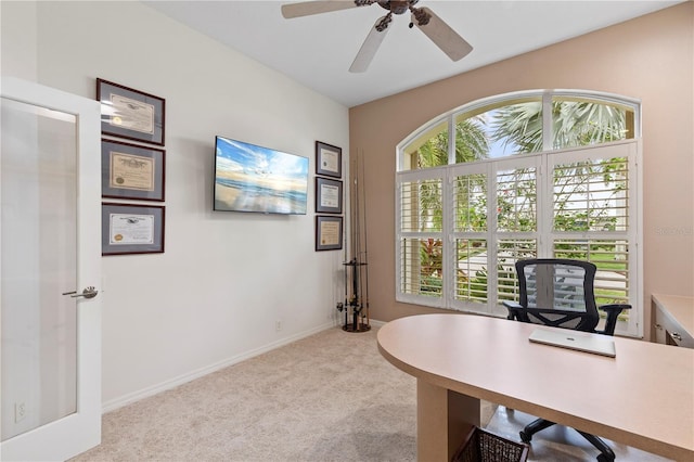 carpeted office with ceiling fan