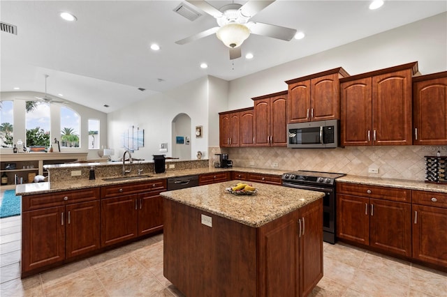 kitchen with lofted ceiling, sink, ceiling fan, kitchen peninsula, and stainless steel appliances