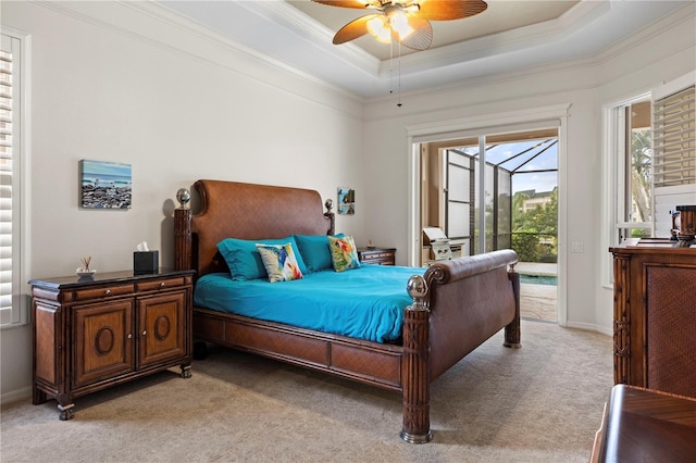 bedroom featuring light carpet, a raised ceiling, crown molding, ceiling fan, and access to exterior