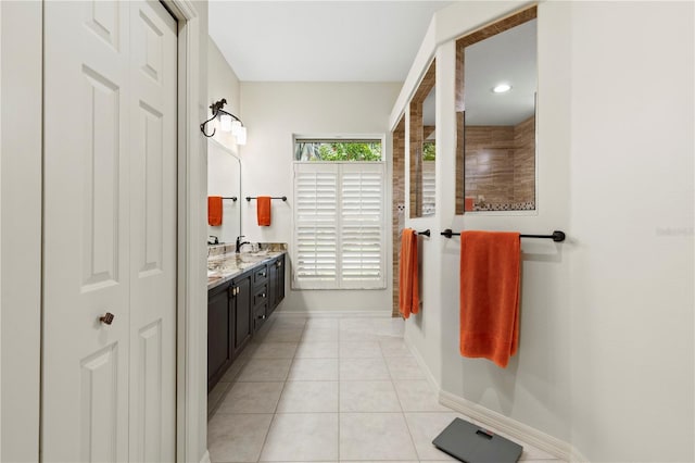 bathroom featuring tile patterned flooring and vanity