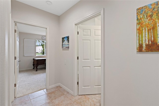 hallway with light carpet