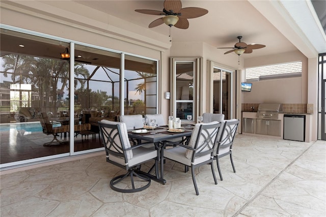 sunroom / solarium featuring ceiling fan