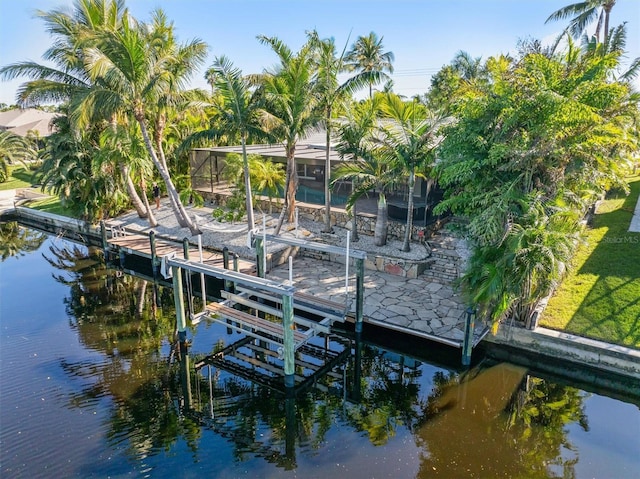 dock area featuring glass enclosure and a water view