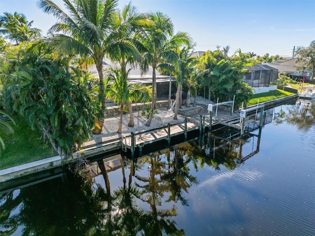 dock area with a water view and a lanai