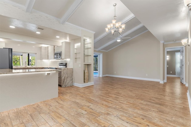 kitchen featuring white cabinetry, light hardwood / wood-style flooring, lofted ceiling with beams, ceiling fan with notable chandelier, and appliances with stainless steel finishes