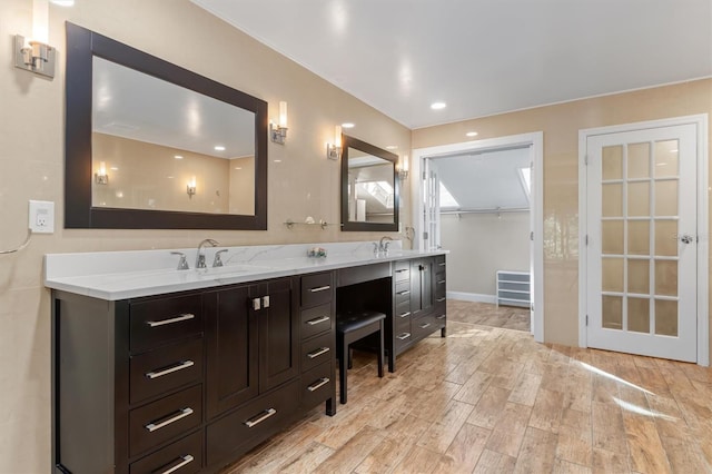 bathroom with hardwood / wood-style floors and vanity