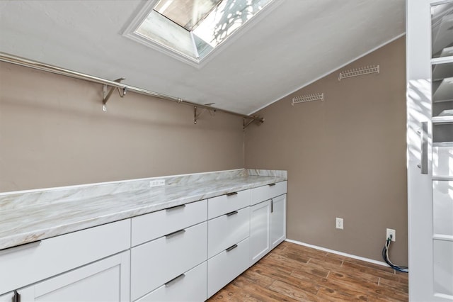 spacious closet featuring hardwood / wood-style flooring