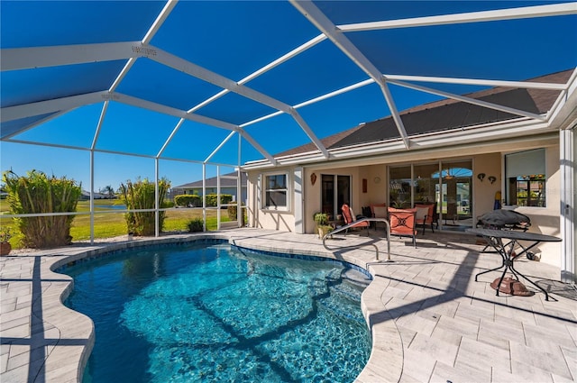 view of pool featuring a patio area and a lanai