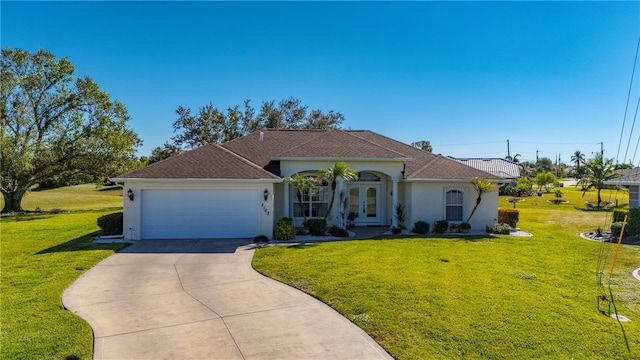 view of front of property featuring a garage, a front yard, and french doors