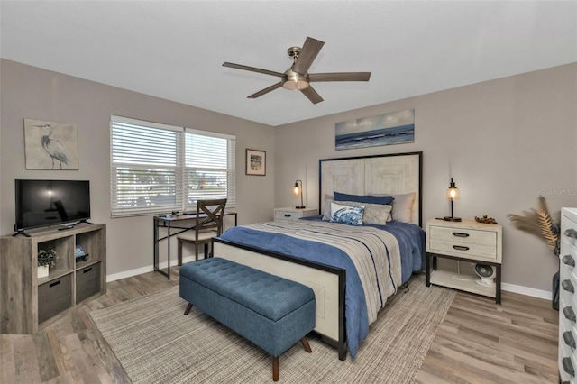 bedroom featuring wood-type flooring and ceiling fan