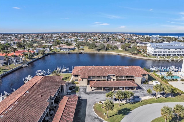 birds eye view of property featuring a water view