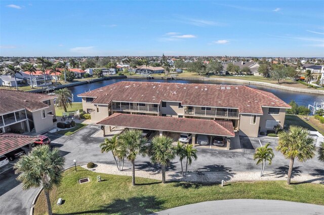 aerial view with a residential view and a water view